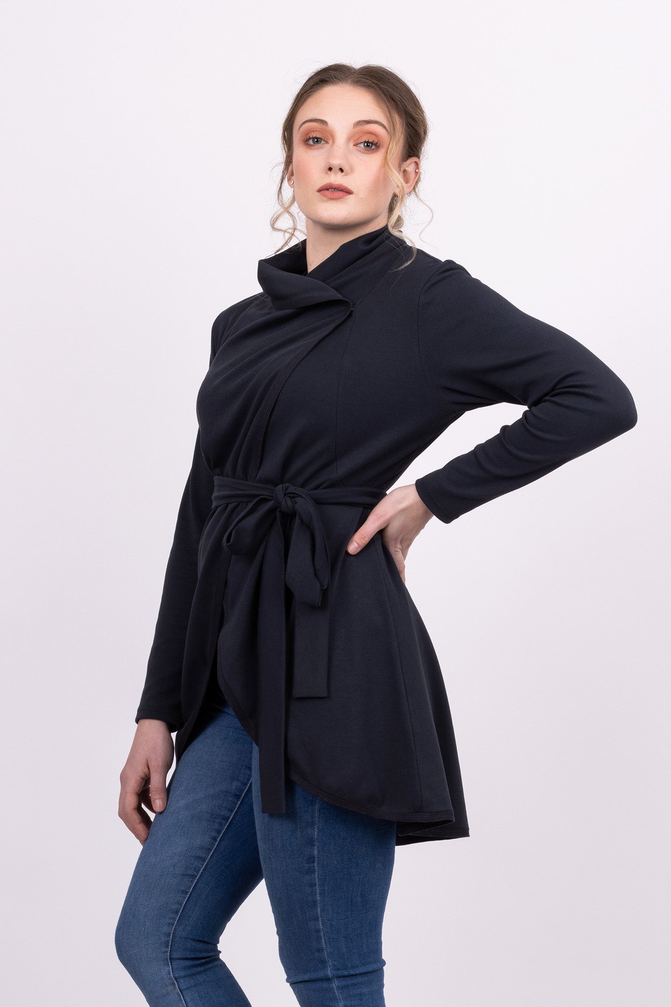 Short Kirsi cardigan in grey, worn closed, with black Ella skirt, front view